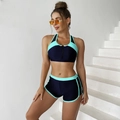 Detail of navy two-piece swimsuit with mint trim and front zipper sport vest - S / Emerald Green