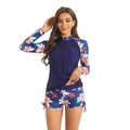 Dettaglio del costume da bagno a maniche lunghe con stampa floreale tropicale e zip - S / Blu Notte