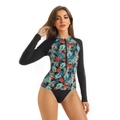 Detail of long sleeve rash guard with tropical leaf print and front zipper closure - S / Black