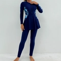 Detail of modest burkini swimwear with long sleeves and blue tropical leaf print - S / Navy Blue
