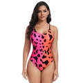 Detailed front view of one-piece swimsuit with pink orange gradient and black cow pattern - S / Gradient Red