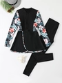 Flat lay of modest two-piece floral long sleeve swimwear with beach vacation accessories - S / Black
