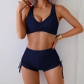 Detail of navy blue bikini top with cross V-neck and ruched drawstring high waist shorts - S / Navy Blue