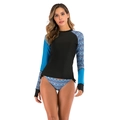 Detail view of long sleeve surf bikini top with thumb holes and geometric print pattern - S / Blue Checkerboard
