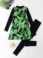Detail view of long-sleeve swimwear with green palm leaf print and matching black leggings - S / Dark Green