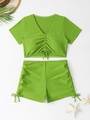 Flat lay of green two-piece bikini with V-neck short sleeve top and high waist shorts - S / Green