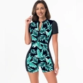Close-up of tropical leaf print one-piece swimsuit with black front zipper detail - XS / Black Tropical Leaf