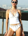 White halter bikini set featuring delicate shell and starfish charms on a modern model - White