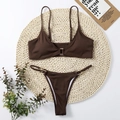 Detail of ribbed dark brown bikini with gold buckle accents on woven straw mat - S / Coffee