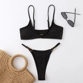 Close-up of ribbed black bikini set featuring elegant gold buckles on white background - S / Black
