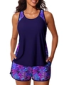 Women's two-piece athletic swimsuit featuring navy vest and tropical palm leaf print shorts - S / Purple