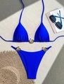 Royal blue two-piece bikini set with golden spiral metal buckles on sand beach props - S / Blue