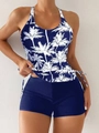 Detail des Bikini-Tops mit Palmendruck, Überkreuzgurten und blauen Boyleg-Badeshorts - S / Königsblau