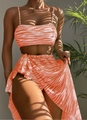 Detailed view of three-piece orange zebra print bikini with matching mesh sarong skirt - S / Orange