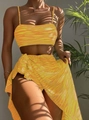 Detail of yellow zebra print bikini set with wrap skirt on model in tropical sunlight - S / Yellow