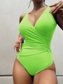 Dettaglio del costume intero verde neon con scollo a V incrociato e lacci laterali - Taglia S / Verde fluorescente