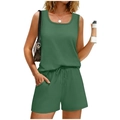 Detail view of dark green athletic shorts with drawstring waist and side pockets - Green