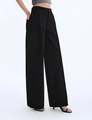Detail of high-waisted black wide-leg trousers with minimalist side pocket design - S / Black