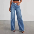 High-waisted wide-leg jeans in mid-blue wash featuring frayed hems and vintage textures - S / Light Blue