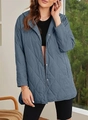 Close-up of blue quilted hooded jacket featuring diamond stitching and button closure - Aqua