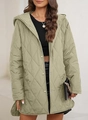 Detail of sage green diamond quilted jacket featuring metal snap buttons and curved hem - Light Green