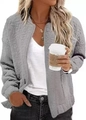 Detail of grey quilted jacket featuring floral texture and zipper closure for women - Gray