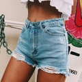 High waisted ripped denim shorts in light blue wash with fringe and distressed detail - S / Light Blue