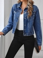 Detailed view of the classic blue denim jacket with metallic buttons and front flap pockets - XS / Cyan Blue