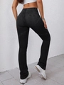 Detail showing high-waisted gray flare jeans with unique star stitching design on back - Black
