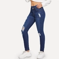 Nahaufnahme von Damen-High-Waist-Jeans mit Distressed-Details und modischen Rissen - S / Dunkelblau