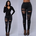 Women's black skinny ripped jeans in high waist style with distressed street fashion details - S / Black