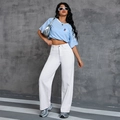 Women's light blue short sleeve T-shirt paired with white high-waisted wide-leg jeans - XL / Bottoms / White
