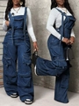 Detailed view of dark blue denim overalls with multiple utility pockets and metal buckles - S / Dark Blue