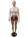 Close-up of white lace long sleeve crop top with intricate hollow embroidery details - S / White