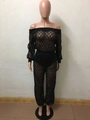 Detail of black sequined mesh two-piece set featuring off-shoulder top and sheer trousers - S / Black