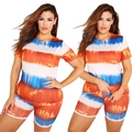 Close-up of vibrant orange and blue tie-dye texture on stretchy knitted short set - Tan