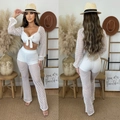 Completo bianco all'uncinetto con top corto a maniche lunghe e pantaloni a zampa d'elefante - Bianco / S