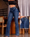 Detail of high waisted flared jeans featuring double button closure and elastic side waist - S / Bottoms / Dark Blue