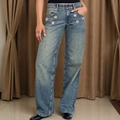 Detailed view of colorful flower patches on high waist light blue wide-leg denim jeans - Pearl Flower Lake Blue