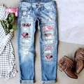 Distressed blue wash denim jeans with pink glitter heart patches and plaid detailing - 3XL