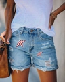 Detail of light blue denim shorts featuring American flag star patches and frayed hems - S / Light Blue Star Print