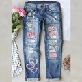 Light blue distressed denim jeans with heart print and ripped details for women - S / Light Blue Leopard Heart