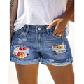 Women's blue denim shorts featuring distressed details and cartoon graphic patch inserts - S / Blue Cartoon Patch Style (TP032011+TP229)