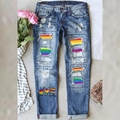 Jeans blu strappati con toppe di paillettes arcobaleno e stampa grafica Peace Love - S / Blu Con Stampa Arcobaleno