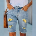 Women's blue denim shorts featuring sunflower floral print lining in ripped details - S / Light Blue Sunflower Print