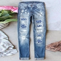 Jean bleu femme taille moyenne avec déchirures et motifs d'étoiles du drapeau américain - S / Bleu clair