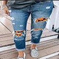 Women's ripped jeans with Halloween pumpkin and bat patches on blue washed denim pants - S / Dark Blue