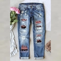 Jeans natalizi da donna con toppe leopardate di paillettes e motivo festivo - S