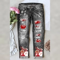 Women's distressed black jeans with festive Christmas Santa print and snowflake patches - S / Black Reindeer Print