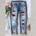 Women's blue ripped jeans with Christmas reindeer print and red plaid patches - S / Blue/Reindeer Print